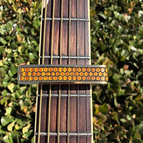 Thalia Premium Series Kapodaster mit schwarzem Chrom-Finish und Curly Hawaiian Koa Honeycomb Einlage