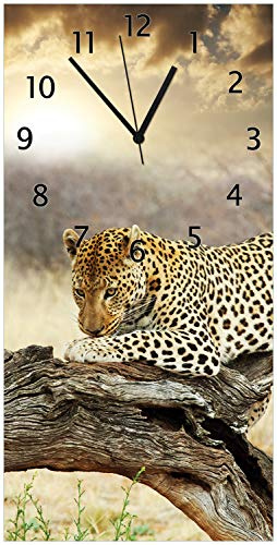 Wallario Design-Wanduhr Leopard auf Baumstamm in Afrika aus Glas, Motiv-Uhr Größe 30 x 60 cm, Schwarze Zeiger