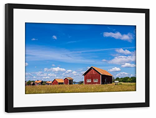 artboxONE Poster mit Rahmen schwarz 45x30 cm Wiese, Holzhäuser, Himmel von Rico Ködder - gerahmtes Poster