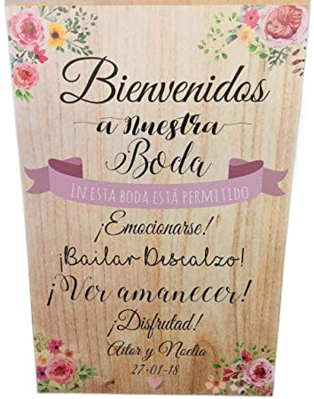 Cartel Bienvenidos a nuestra Boda flores con flores y fondo de madera.