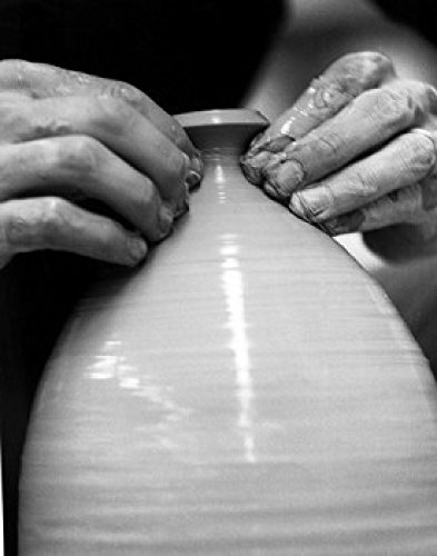 Potter working on a pottery wheel Poster Print (24 x 36)