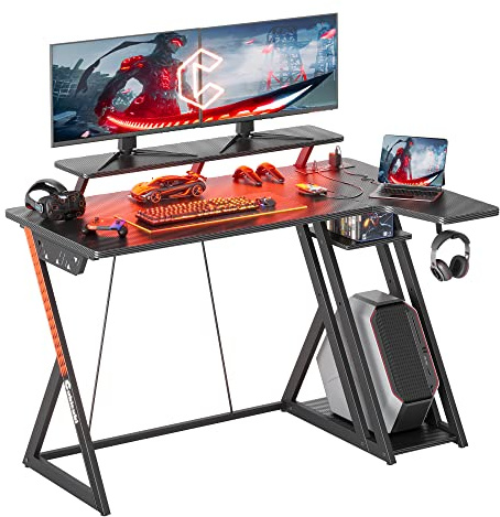 CubiCubi L Shaped Gaming Desk with Power Outlets & LED Lights, 120 x 70 cm Computer Desk with Monitor Stand, Office Desk Small Table with Shelves & Hooks, for Study Play Work Home Office, Black